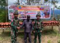 Satgas Yonif 521/DY Turut Hadir Acara Pameran Buah Merah di Distrik Kelila